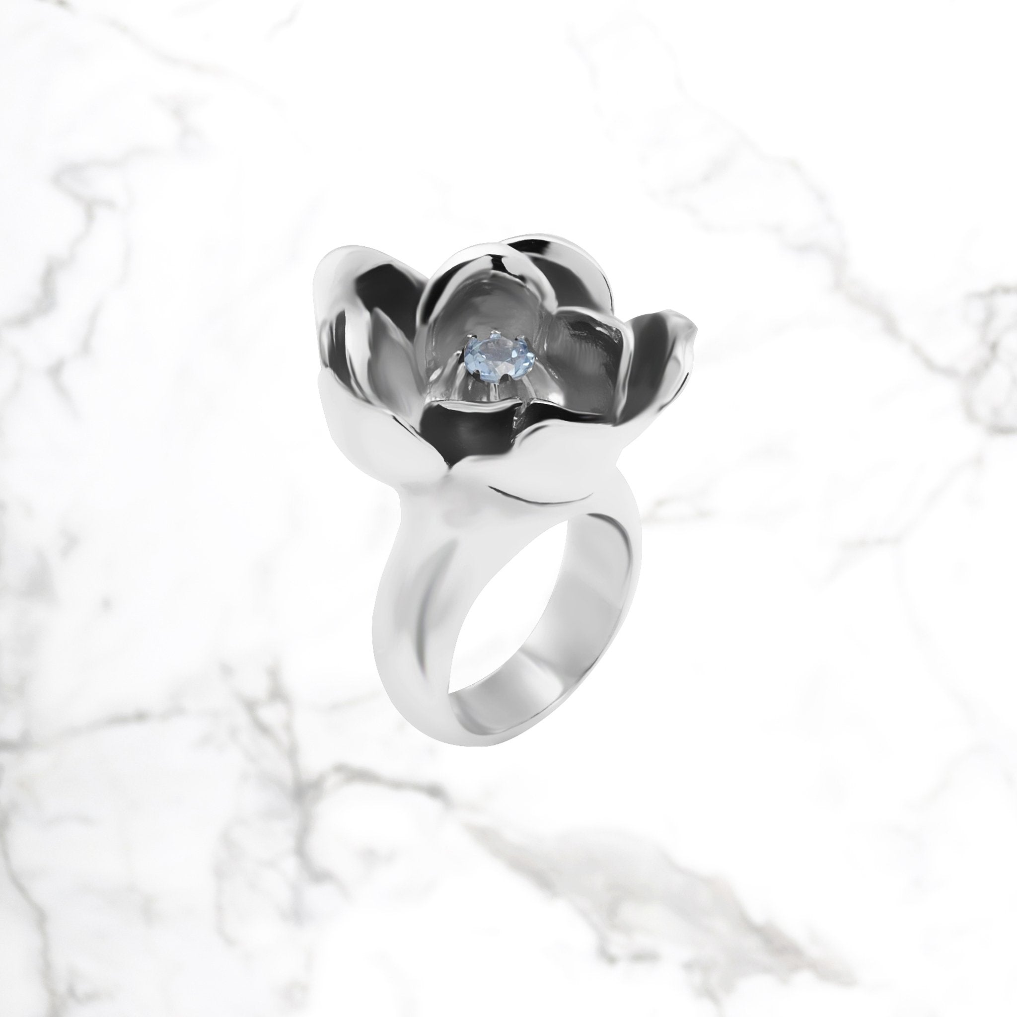 Handcrafted M2 flower ring with lab-grown blue topaz