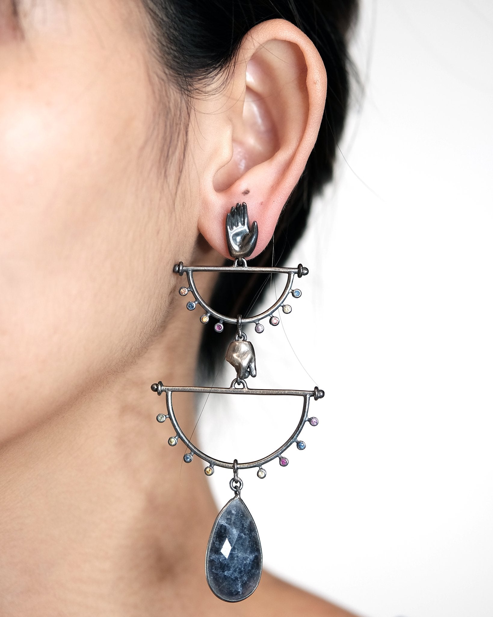 Double-tiered hand chandelier earrings with sapphires and midnight blue agate