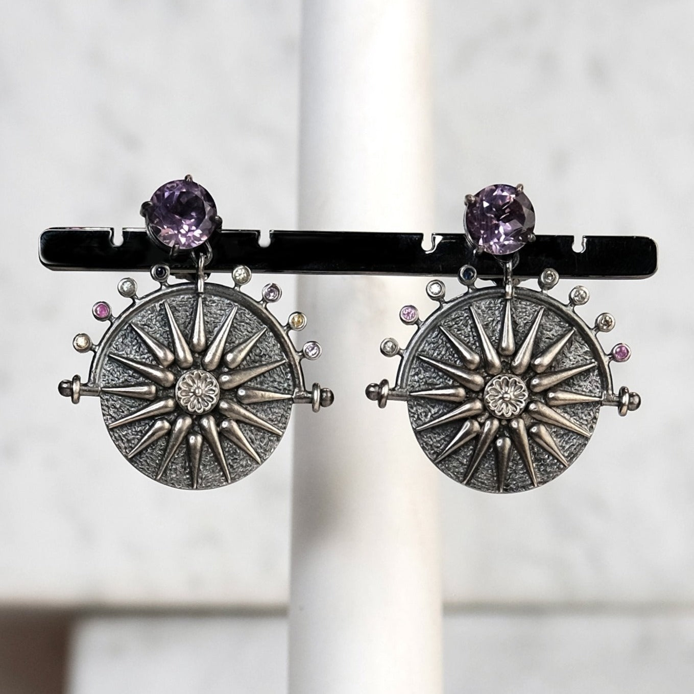 The Madstone star compass earrings